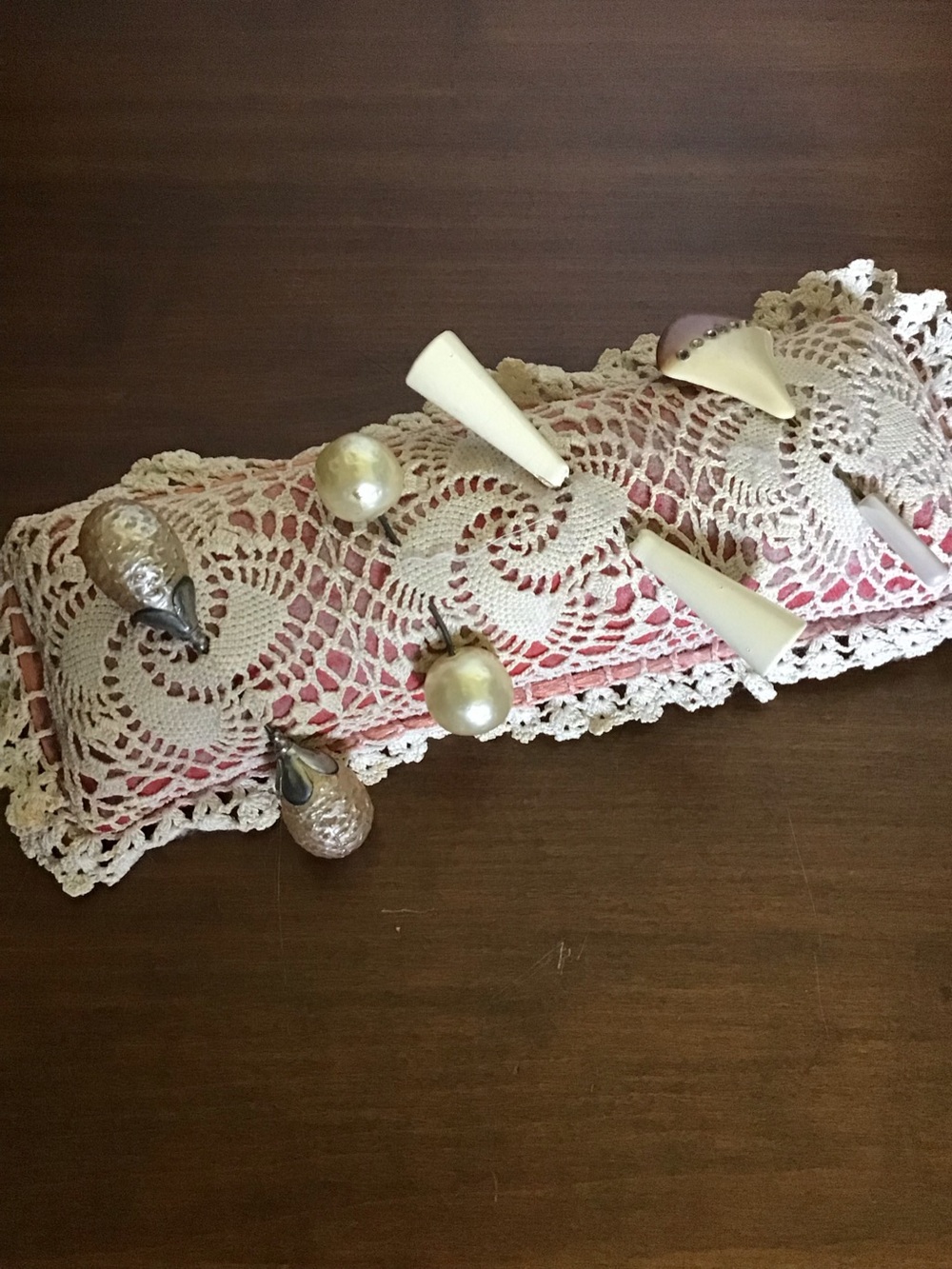 Collection of Antique Hat Pins display of lace pin cushion